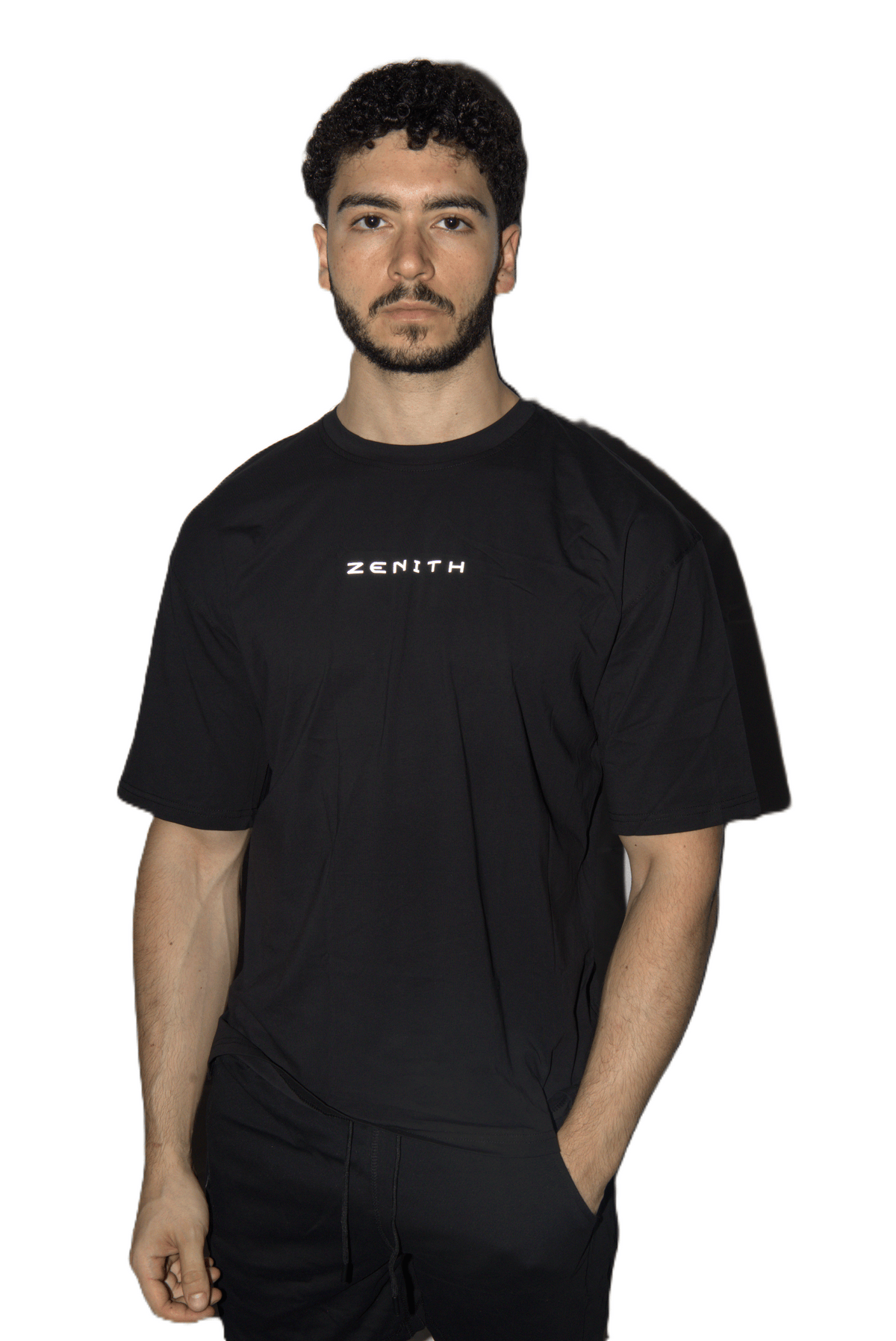 A man wearing a black short-sleeve t-shirt with the brand name 'ZENITH' printed in white on the chest, set against a plain white background.